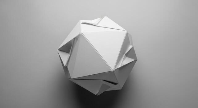 A white paper sculpture with a geometric design photo