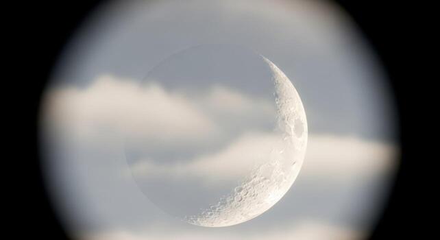 The moon is seen through a circular lens photo