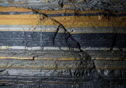 A close up of a rock wall with many different colors photo