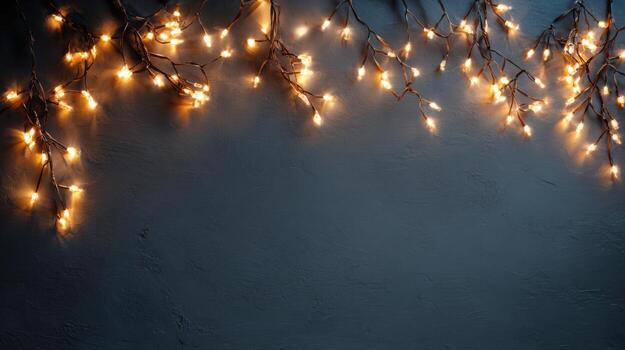 Warm fairy lights, string light border, dark background, copy space for festive mood photo
