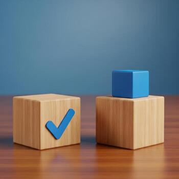 Two wooden blocks with a blue checkmark on one and a blue cube on the other isolated on white background photo
