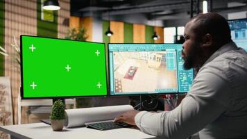 Black property developer analyzing infrastructure layout with copy space, preparing site development plans and reviewing architectural measurements for housing. Market growth. Camera A. video