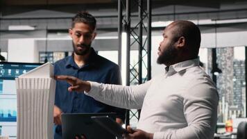 Contractors and property developers work together on a city planning initiative aimed at infrastructure and housing growth through investment and design. Architectural 3D models. Camera B. video