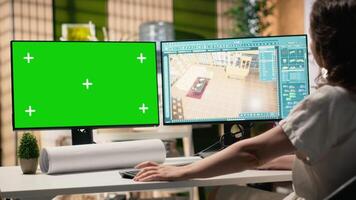 utvecklare i en företags- arbetsyta analyserar bemästra planer med attrapp skärm, infrastruktur strategi och webbplats förberedelse detaljer till säkerställa hus och fast egendom investering Framgång. kamera b. video