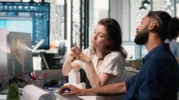 Engineer and property developer working with architectural design software, analyzing project layouts and renovation strategies for real estate expansion and urban development. Camera B. video