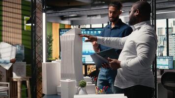 Contractors and property developers work together on a city planning initiative aimed at infrastructure and housing growth through investment and design. Architectural 3D models. Camera A. video