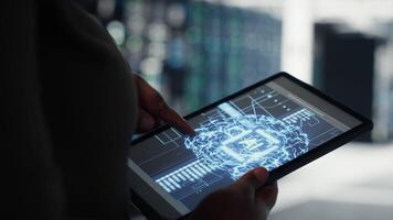 Close up of data center technician doing AI data analysis on tablet to upgrade infrastructure. Server room employee using device to manage storage systems for machine learning training datasets video