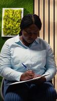Vertical Close up of candidates filling in registration forms for job application and interview, ensuring a great recruitment process and successful meeting with the HR. Write down qualifications. Camera A. video