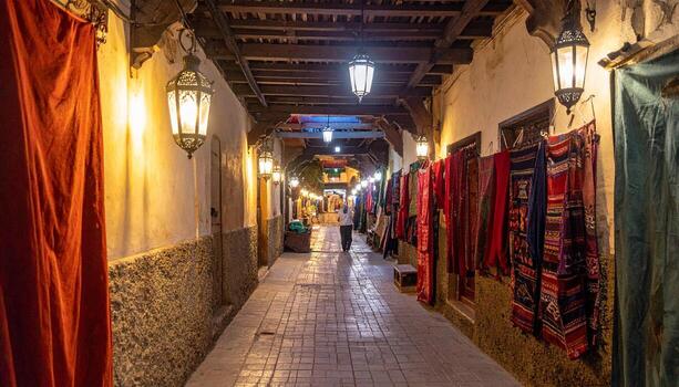 Illuminated Alleyway in Marrakech Lanterns Textiles and Atmospheric Lighting. photo