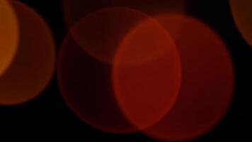 Orange Circular Bokeh Lights Shine at Night, Creating Abstract Pattern video