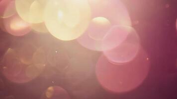 glittrande lampor bokeh effekt abstrakt bakgrund lyser och glöder i mörk mauve och guld video