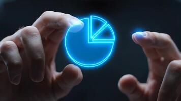 Pie Chart Data Visualization Displayed Between Two Hands on a Dark Background video