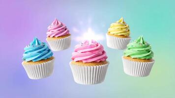 färgrik muffins med pastell glasyr och strössel flytande mot en lutning bakgrund video