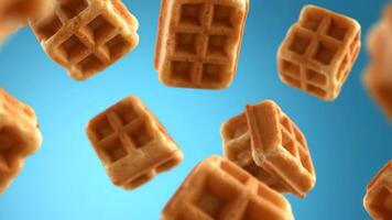 våfflor är flytande och roterande mot blå himmel i en studio miljö video