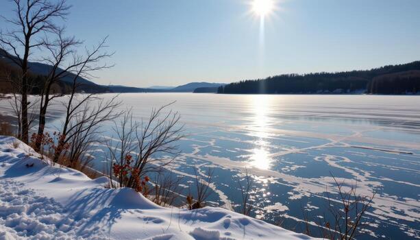 the lake rests frozen, snow covering every inch, subtle icy patterns visible under pale winter sunlight. photo
