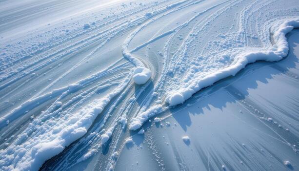 snow drifts across the frozen lake, gentle white waves forming patterns where ice and powder meet. photo