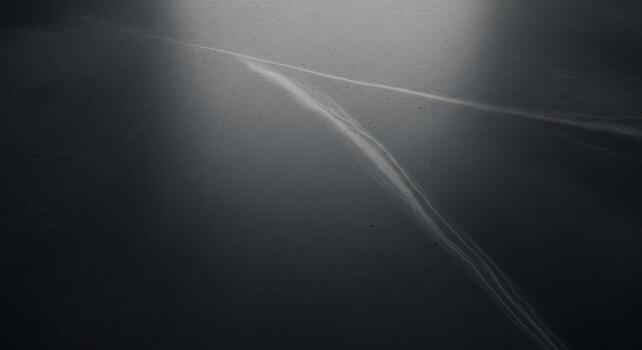 Abstract dark grey polished surface with subtle light streaks and minimalist texture photo