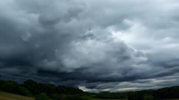 Ominous Dark Clouds Gathering Over Green Field in Rural Ireland on Overcast Day video