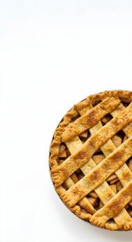 Top down view of a freshly baked homemade apple pie with a golden lattice crust, isolated on a white background with ample copy space photo