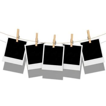 Blank instant photos hanging on a clothesline with wooden clothespins isolated on white