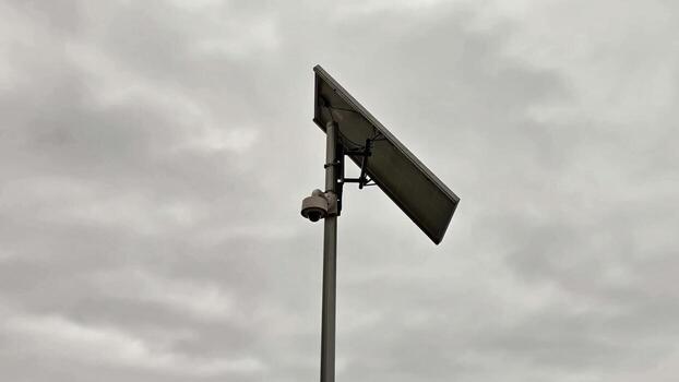 Installing a solarpowered security camera can be effectively done even in overcast weather photo