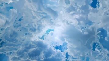 Light Blue Ink Droplets Dissolving and Spreading in Water Creating Abstract Shapes video