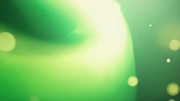 grön abstrakt strömmande ljus med bokeh effekter, slät rörelse bakgrund video
