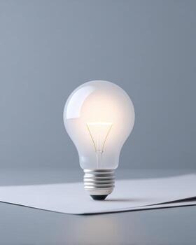 Glowing lightbulb representing bright idea and creative concept for innovation. An inspirational symbol of energy, power, and finding solution with pure creativity photo