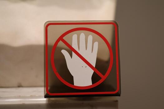 The implementation of No Hand Signage in Various Public Spaces for Enhanced Safety and Communication photo