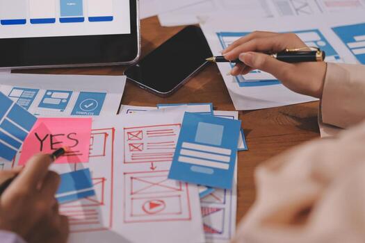 Designing UI/UX with sketches and devices photo