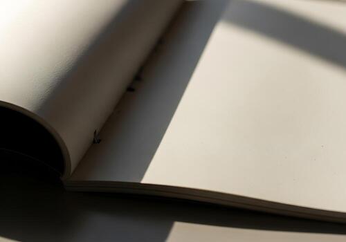 Blank Book Pages with Soft Light and Shadows Ideal for Copy Space and Design Elements photo