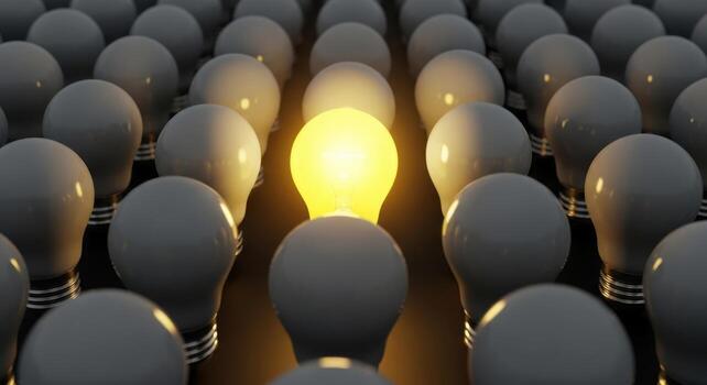 Bright idea lightbulb stands out among many dim bulbs symbolizing innovation photo