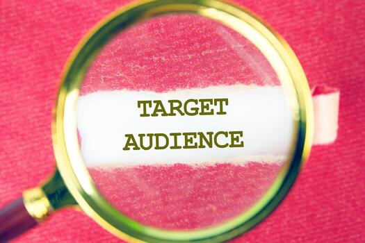 Using a magnifying glass to emphasize the significance of identifying the target audience in technology-driven business concepts photo