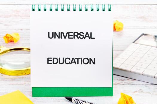 Universal education theme explored through notebook displays and essential tools on a workspace designed for business and finance studies photo