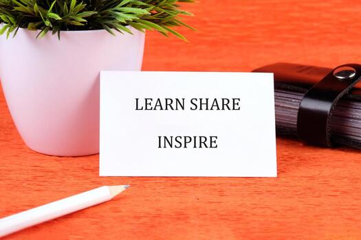 Education concept highlighting learn, share, and inspire in business and finance setting with vibrant background photo
