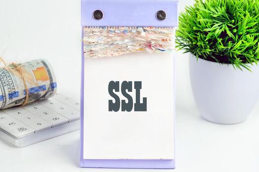 SSL Secure Sockets Layer on a piece of a desktop calendar with tear-off pages photo