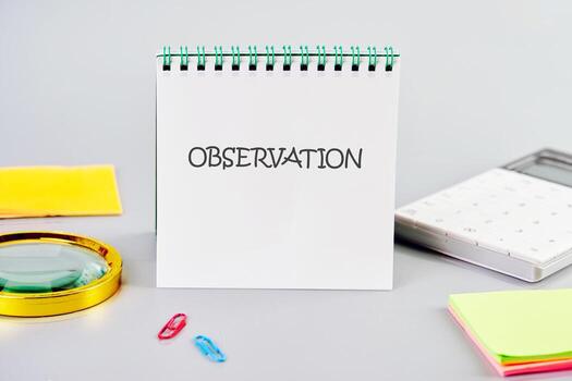 OBSERVATION word written in a notebook in a composition with a calculator, a magnifying glass, and stickers. Observation concept image photo