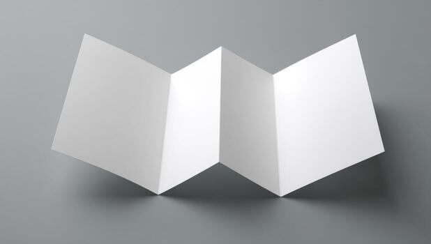 White folded paper on a gray background photo