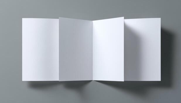An open white folded book on a gray background photo