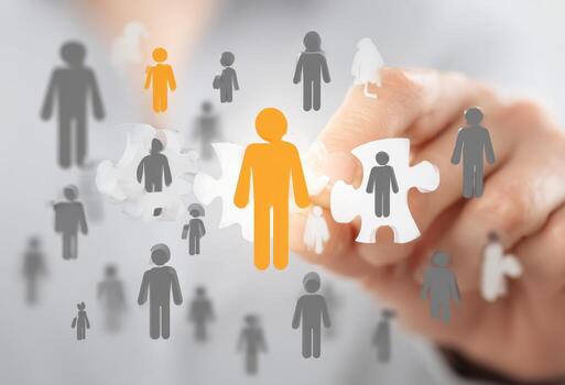 Hand holding puzzle pieces with people in the background photo