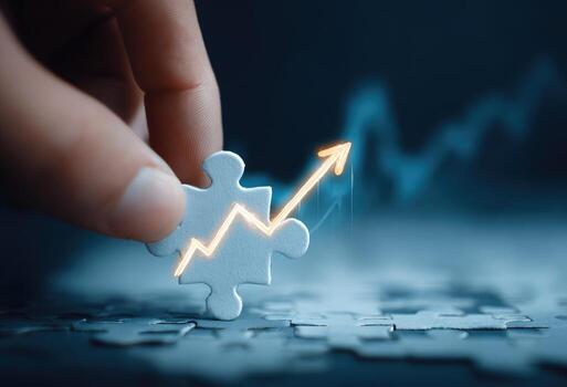 Hand holding jigsaw puzzle with arrow going up photo