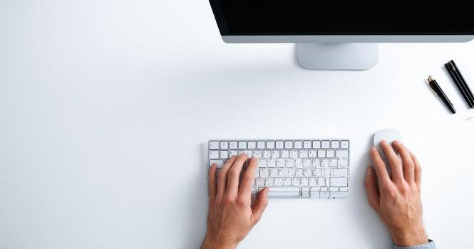Hands typing on a computer keyboard photo