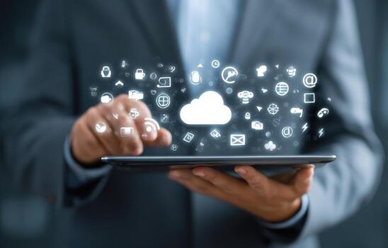 Man holding tablet with cloud icons photo