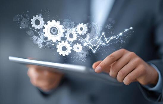 Businessman using tablet with gears and arrows concept photo