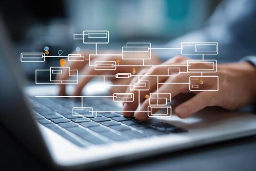 Man typing on laptop with business diagram on screen photo