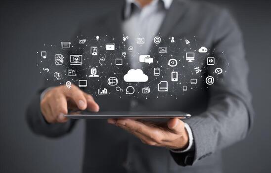 Man holding tablet with icons on it photo