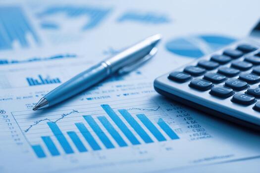 A pen and calculator on a business document photo