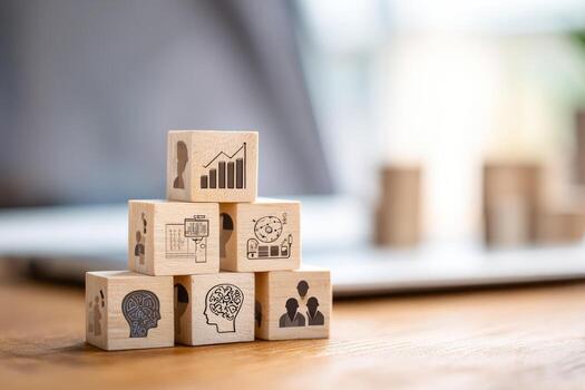 Wooden cubes with icons of business and finance on them photo