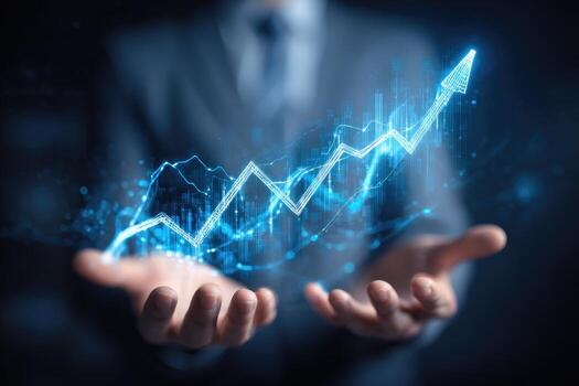 Businessman holding up graph chart with rising up arrow photo