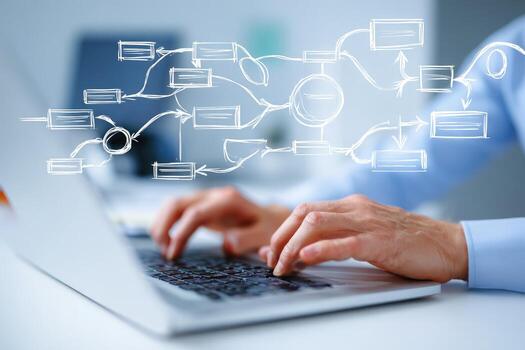 A person is typing on a laptop with a diagram drawn on it photo